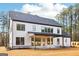 Two-story home featuring a covered porch and a spacious backyard at 3735 Tamiami Trl, Cumming, GA 30041