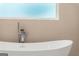 Modern bathtub and shower fixtures at 3735 Tamiami Trl, Cumming, GA 30041