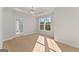 Bright bedroom featuring a tray ceiling and an ensuite bath at 3735 Tamiami Trl, Cumming, GA 30041