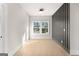 Modern bedroom with bright windows and a dark accent wall at 3735 Tamiami Trl, Cumming, GA 30041