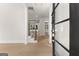 Open entryway showcases a modern staircase, light wood floors, and view into other rooms at 3735 Tamiami Trl, Cumming, GA 30041