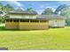 Large backyard features a spacious yard and a screened in back porch area at 102 Crystal River Dr, Riverdale, GA 30274