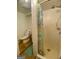 Full bathroom featuring a shower with bright shower curtain, toilet, and tiled walls at 102 Crystal River Dr, Riverdale, GA 30274
