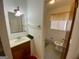 Bathroom featuring a vanity and mirror and toilet room through an open door at 102 Crystal River Dr, Riverdale, GA 30274