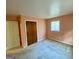Bedroom with ample closet space and natural lighting, plus neutral colored walls and flooring at 102 Crystal River Dr, Riverdale, GA 30274