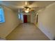 Spacious bedroom with tiled floors, ceiling fan, closet, and natural light at 102 Crystal River Dr, Riverdale, GA 30274