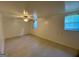 Basement bedroom featuring windows for natural light and neutral colored walls at 102 Crystal River Dr, Riverdale, GA 30274