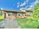 Charming single Gathering home with a brick facade and a well maintained lawn at 102 Crystal River Dr, Riverdale, GA 30274