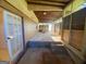 Enclosed patio with cement floor, brick walls, steps and lots of natural light at 102 Crystal River Dr, Riverdale, GA 30274