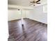 Finished basement with modern flooring, columns, and a white door at 7340 Chalk Way, Riverdale, GA 30296