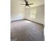 Bedroom featuring new carpet, neutral walls, and natural lighting from one window at 7340 Chalk Way, Riverdale, GA 30296