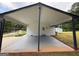 Spacious carport providing sheltered parking with a convenient entrance to the main house at 7340 Chalk Way, Riverdale, GA 30296