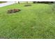 Well-manicured lawn with flower beds at 7340 Chalk Way, Riverdale, GA 30296