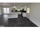 Contemporary kitchen with stainless steel appliances, sleek island, and backyard access at 7340 Chalk Way, Riverdale, GA 30296