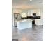 Modern kitchen with white cabinets, stainless steel appliances, and island at 7340 Chalk Way, Riverdale, GA 30296