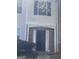Charming townhome entrance featuring a secure black metal door and classic brick accents at 2754 Vining Ridge Terrace, Decatur, GA 30034