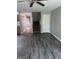 Inviting living room with modern gray floors, a ceiling fan, and a staircase leading to the upper level at 2754 Vining Ridge Terrace, Decatur, GA 30034