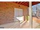 A covered basement patio with double doors providing access to additional storage or recreational space at 315 Antebellum Way, Fayetteville, GA 30215
