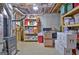 Unfinished basement with an unfinished block wall with insulation, shelving, and storage at 315 Antebellum Way, Fayetteville, GA 30215