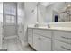 Bathroom with tile floors featuring a vanity with drawers and a mirror with vanity lighting at 315 Antebellum Way, Fayetteville, GA 30215