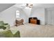 Spacious bonus room featuring carpeted floors, natural light, and vaulted ceiling at 315 Antebellum Way, Fayetteville, GA 30215