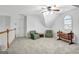 Lofted bonus room with vaulted ceiling, ceiling fan, and natural light at 315 Antebellum Way, Fayetteville, GA 30215