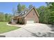 Brick home with attached garage and spacious driveway at 315 Antebellum Way, Fayetteville, GA 30215