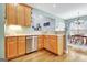 Another view of kitchen with dishwasher, stainless steel appliances and view to eat-in area at 315 Antebellum Way, Fayetteville, GA 30215