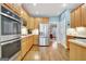 Beautiful kitchen featuring stainless steel appliances, hardwood floors, and views of the eating area at 315 Antebellum Way, Fayetteville, GA 30215