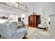 Spacious living room with high ceilings, upper balcony, hardwood floors, and beautiful wood entertainment center at 315 Antebellum Way, Fayetteville, GA 30215