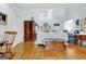 Bright living room featuring hardwood floors, a vaulted ceiling, and a traditional fireplace for cozy gatherings at 315 Antebellum Way, Fayetteville, GA 30215