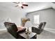 Cozy room featuring reclining chairs, neutral paint colors, a ceiling fan and carpet floors at 315 Antebellum Way, Fayetteville, GA 30215