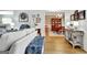 Open living area showcasing hardwood floors and seamless transition to the dining room with decorative accents at 315 Antebellum Way, Fayetteville, GA 30215