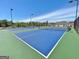 Well-maintained pickleball courts with bright blue surfaces and a green border, perfect for recreational play at 315 Antebellum Way, Fayetteville, GA 30215