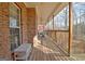 Spacious covered porch with brick and wooded view at 315 Antebellum Way, Fayetteville, GA 30215