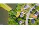 A captivating aerial view of a neighborhood, showcasing meticulously manicured lawns and serene lake at 255 Hidden Lake Dr, Fayetteville, GA 30215