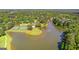 Expansive lake with tennis courts, fountain, dock, and surrounding trees offering recreational amenities at 255 Hidden Lake Dr, Fayetteville, GA 30215