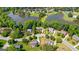 Aerial shot of the community, highlighting the lush landscaping and proximity to a tranquil lake at 255 Hidden Lake Dr, Fayetteville, GA 30215