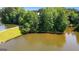 Beautiful lake view with lush green trees and a charming gazebo on a sunny day at 255 Hidden Lake Dr, Fayetteville, GA 30215