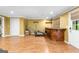 Finished basement area with hardwood floors, bar, work out equipment, and access to the backyard at 255 Hidden Lake Dr, Fayetteville, GA 30215