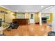 Finished basement featuring hard wood floors, recessed lighting, a bar, and workout equipment at 255 Hidden Lake Dr, Fayetteville, GA 30215