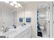 Bright bathroom with dual sinks and a door leading to the toilet and shower at 255 Hidden Lake Dr, Fayetteville, GA 30215
