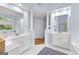 Spacious primary bathroom with dual vanities, white cabinets, and a walk-in shower at 255 Hidden Lake Dr, Fayetteville, GA 30215
