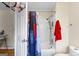 Clean bathroom featuring a tub with a shower, a privacy curtain, and ample space, providing a functional design at 255 Hidden Lake Dr, Fayetteville, GA 30215