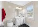 Bright bathroom with a sleek vanity, a well-lit mirror, and a modern toilet, creating a clean and functional space at 255 Hidden Lake Dr, Fayetteville, GA 30215