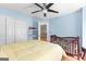 Bright bedroom featuring pale blue walls, white trim, and a charming crib, perfect for a Bedroom or room at 255 Hidden Lake Dr, Fayetteville, GA 30215