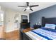 Bedroom with hardwood floors and a navy accent wall at 255 Hidden Lake Dr, Fayetteville, GA 30215