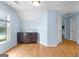 Upstairs bedroom with hardwood floors, dresser, and a closet at 255 Hidden Lake Dr, Fayetteville, GA 30215