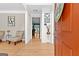 Open foyer featuring hardwood floors, neutral walls, and glimpses of the home's layout at 255 Hidden Lake Dr, Fayetteville, GA 30215