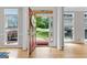 Inviting foyer with hardwood floors, natural light, and a welcoming view of the outdoors at 255 Hidden Lake Dr, Fayetteville, GA 30215